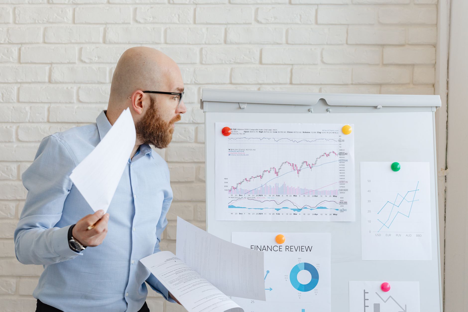 Business professionals reviewing data reports for monetising internal data in professional services