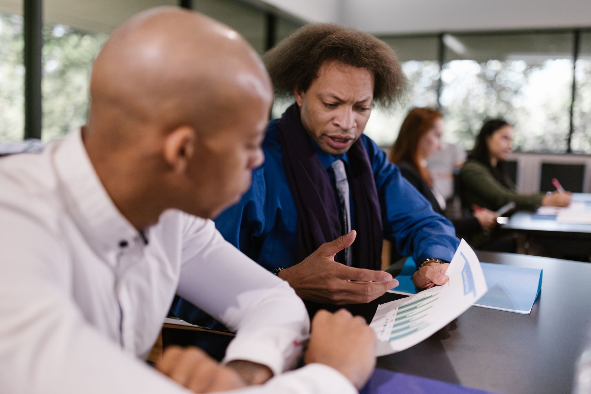 UK founders reviewing revenue-based financing options in a modern office