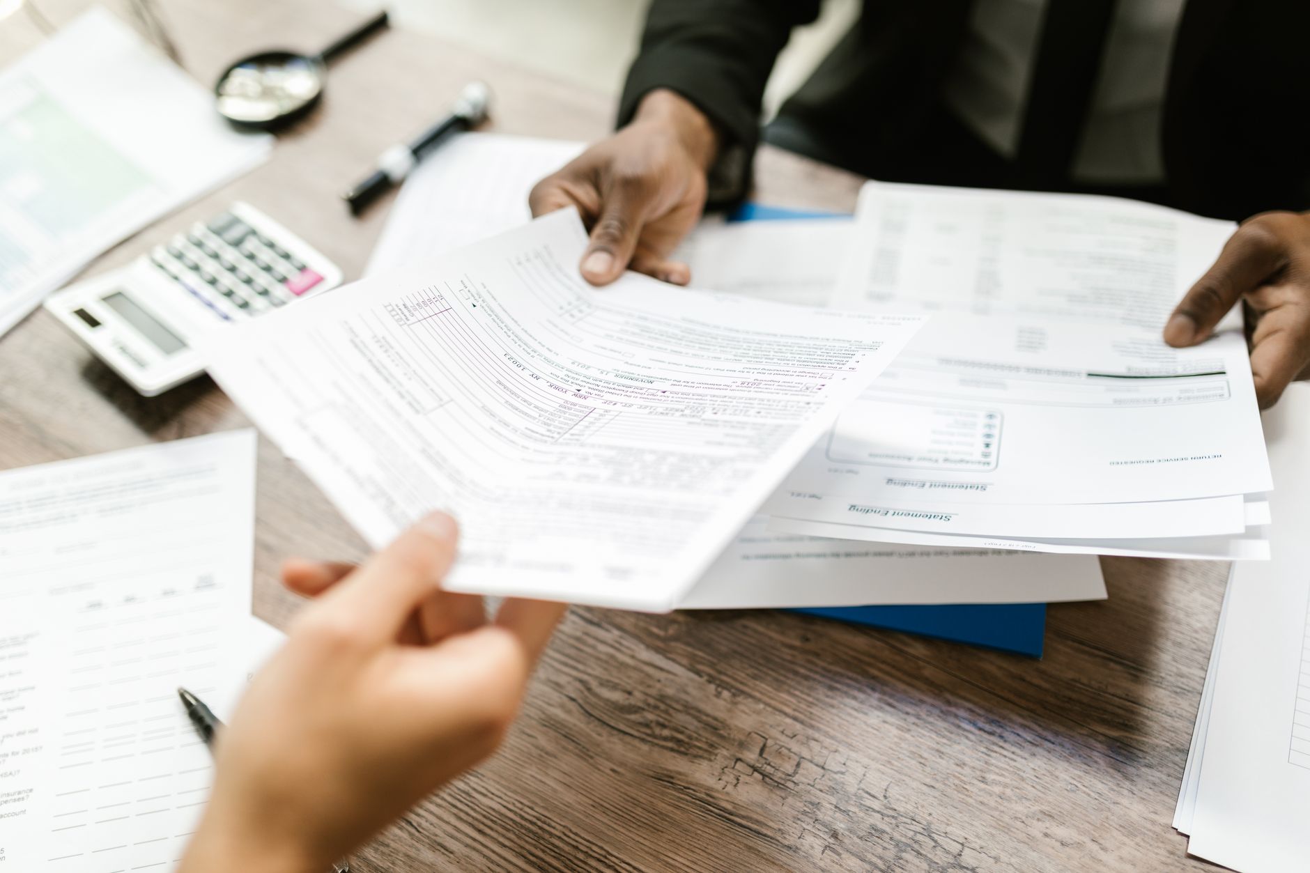 Finance professionals reviewing supplier documents as part of vetting UK suppliers using Companies House data